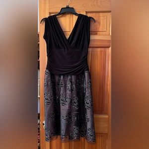 New with tags. Women’s party dress. Size 14.